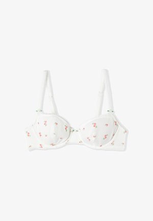 Reggiseno bianco con ferretto, piccoli motivi a rosa rosa, spalline regolabili e delicati accenti di fiocco verde su uno sfondo bianco semplice.