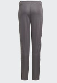 Sportliche Hose aus dunklem Graumaterial, mit einer schlanken Passform, elastischem Bund und weißen seitlichen Akzenten für ein kontrastierendes Design.