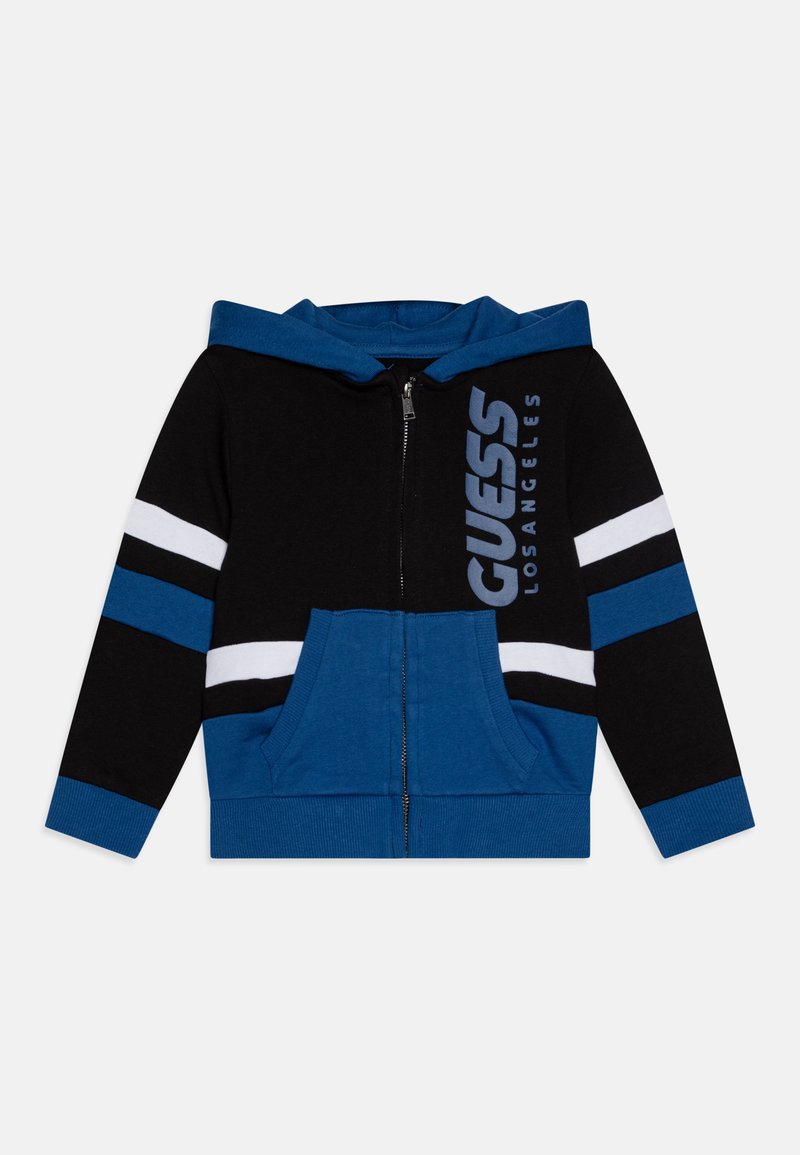 Black and blue zip-up hoodie with white stripes, featuring a front pocket and branded text "GUESS LOS ANGELES" on the left side.