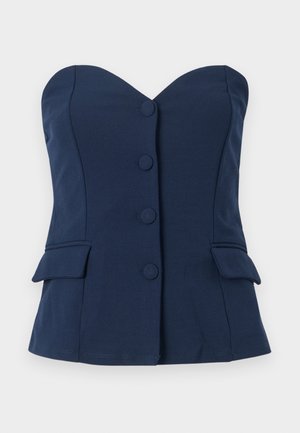 Top sin mangas en azul marino con escote corazón, botones en el frente y bolsillos laterales. Confeccionado en una tela suave, presenta un corte ajustado.