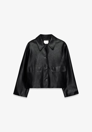 Black faux leather cropped jacket with wide pointed collar, long sleeves, front buttons, and two flap pockets.