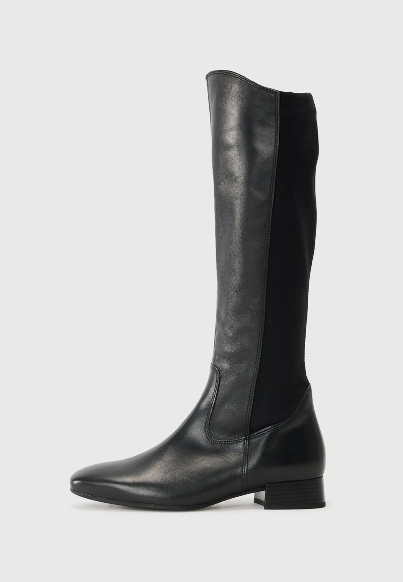 Knee-high black boots with a smooth leather front and stretchy fabric panel. Features a low block heel and pointed toe design.