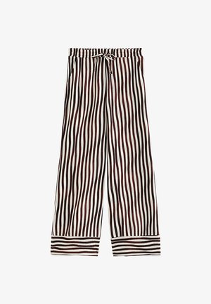 Pantalones sueltos con rayas onduladas verticales en negro y marrón sobre fondo blanco, cintura elástica con lazo frontal y puños con rayas horizontales.