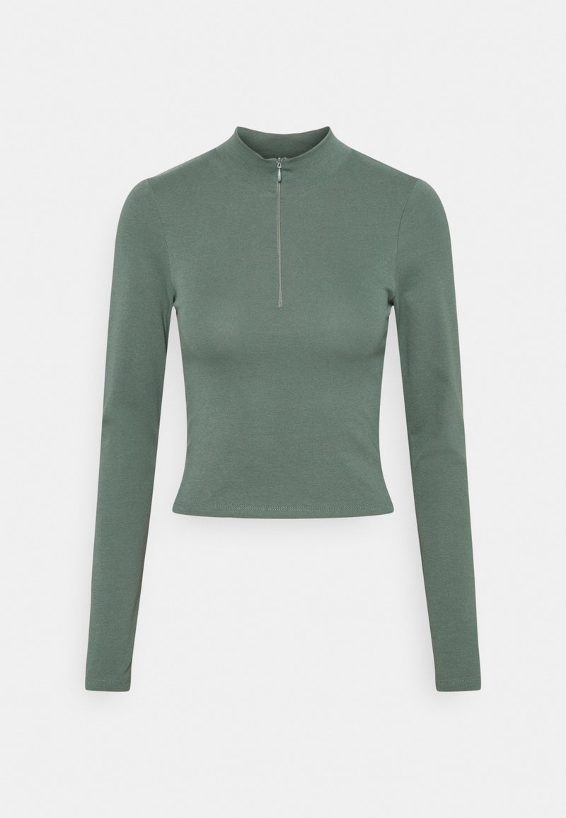 Long-sleeve, cropped top in muted green, made from smooth, stretchy fabric with a high neck and a front zipper detail.