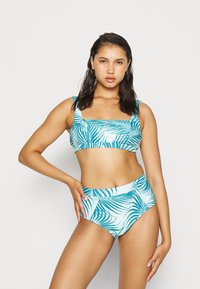 Svetlo modri bikini z kvadratnim izrezom, širokimi naramnicami in visokim pasom z vzorcem zelenih palmovih listov. Gladka tekstura.