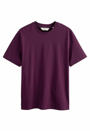 Lyhythihainen t-paita syvässä purppurassa. Valmistettu pehmeästä puuvillasta, jossa on klassinen pyöreä kaula-aukko ja suora leikkaus. Ei näkyviä kuvioita tai koristeluja.