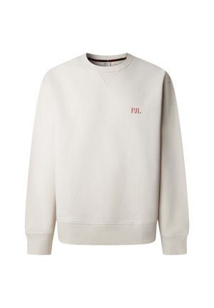 Šviesiai smėlio spalvos džemperis su ilgomis rankovėmis, ribbed apatinių rankovių ir apačios. Kairėje krūtinės pusėje maža raudona "PJL" logotipas. Lygus paviršius.