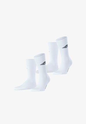 White cotton crew socks with ribbed texture and logo. Four pairs displayed, featuring a solid design and reinforced heel and toe.