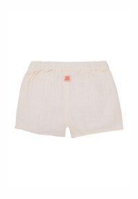 Shorts de couleur crème clair en tissu texturé avec une taille élastique froncée, présentant une petite étiquette de marque orange sur le devant.