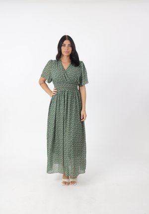 Abito maxi floreale verde con maniche corte a palloncino, vita arricciata e gonna fluida. Presenta un tessuto morbido e leggero con delicati motivi floreali.