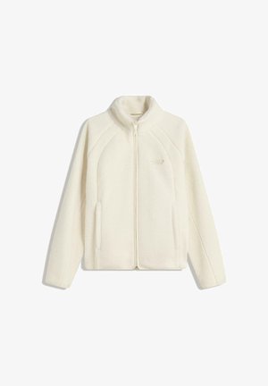 Fleece zip-up jack in crème kleur. Heeft een hoge kraag, zijzakken en een patroonstiksel langs de mouwen. Zachte textuur.