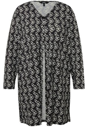 Zwarte cardigan met een V-hals, lange mouwen en een herhalend wit cirkelpatroon. Het heeft een knoopsluiting bij de hals.