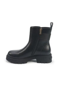 Black leather ankle boot with side zipper, textured sole, and a cushioned, chunky heel. Features a pull tab and elastic band for fit.
