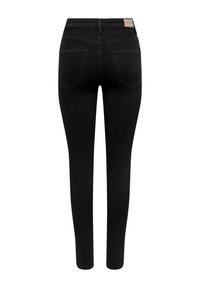 Jeans skinny noirs taille haute avec deux poches arrière et une étiquette de marque beige sur la ceinture, présentés de dos.