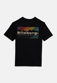Black cotton t-shirt featuring a colorful graphic with mountains and the text "Billabong Adventure Division" in beige and green.