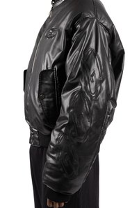 Black leather bomber jacket with textured fabric, ribbed cuffs, front pockets, and raised logo details on the sleeves.
