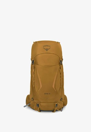 Grand sac à dos de randonnée Osprey Kyte 48 de couleur jaune moutarde avec plusieurs compartiments et bretelles réglables, présenté de face sur fond blanc.