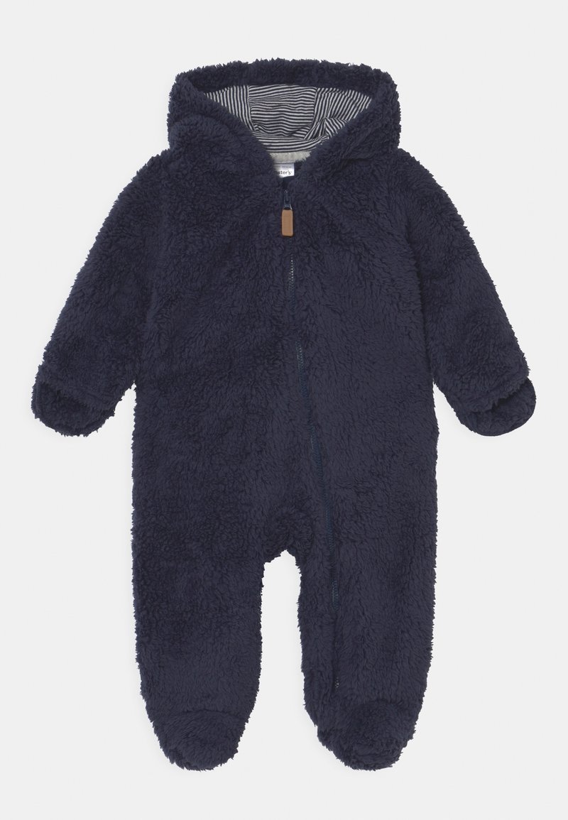 Combinaison bébé à capuche bleu marine duveteuse avec doublure intérieure rayée grise et noire et fermeture éclair frontale.