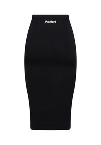 Jupe crayon noire en tissu extensible. Caractérisée par une taille haute et un logo "Wolford" blanc en haut. Texture lisse, design mi-long.