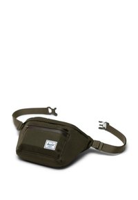 Banane de couleur verte olive fabriquée en tissu durable, dotée d'une poche avant avec fermeture éclair, d'une sangle réglable et d'une étiquette logo sur le côté.