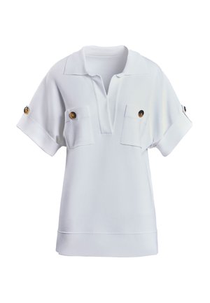 White short-sleeve polo shirt with a V-neck, two chest pockets, and brown button accents on sleeves. Soft fabric with a relaxed fit.