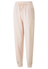 Pantalones de chándal rosas, hechos de una tela suave, con una cinturilla elástica con cordón, bolsillos laterales y un pequeño logo en el muslo izquierdo.