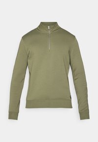 Felpa verde oliva con collo alto e chiusura a mezza zip. Presenta maniche lunghe e polsini a costine, realizzata in un tessuto morbido.