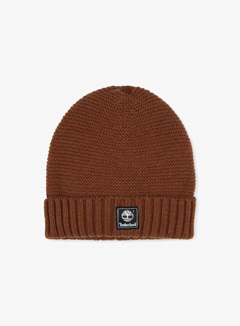 Bruine gebreide beanie met een geribde manchette en een klein zwart Timberland logo patch. Gemaakt van zachte, gestructureerde draad voor warmte.