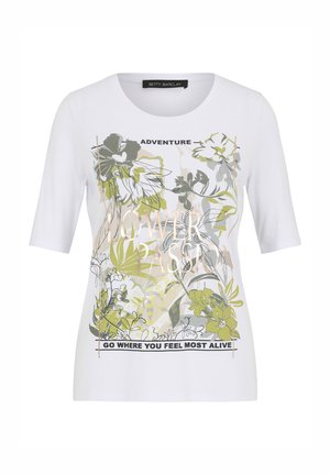 Weißes T-Shirt mit kurzen Ärmeln, das ein florales Design in Grün und Grau zeigt, mit dem Text "ABENTEUER" und "GEHE DORTHIN, WO DU DICH AM LEBENDIGSTEN FÜHLST."