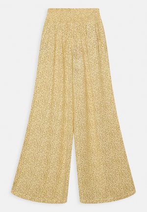 Pantalon jaune taille haute à jambes larges avec un petit imprimé floral vert et une taille élastique.