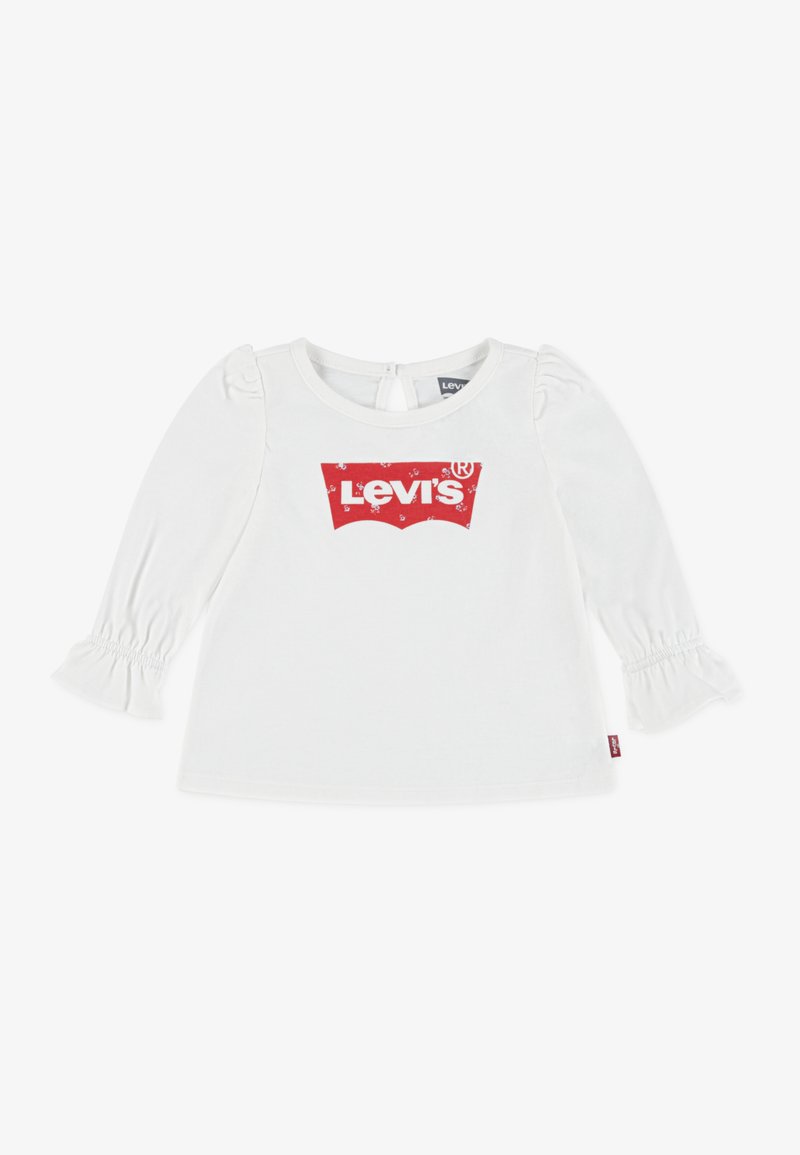 Fehér, hosszú ujjú póló fodros mandzsettával, elől piros Levi's logóval. Puha pamut anyag, kerek nyakkivágás, kulcslyukas hátsó záródás.