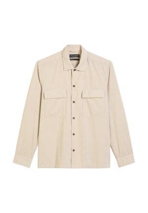 Helltbeige Langarmshirt mit durchgehender Knopfleiste, zwei Brusttaschen und klassischem Kragen. Weiche Textur mit einem dezenten Rippmuster.