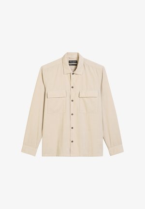 Helltbeige Langarmshirt mit durchgehender Knopfleiste, zwei Brusttaschen und klassischem Kragen. Weiche Textur mit einem dezenten Rippmuster.