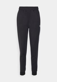 RADIA TAPERED TRACK PANTS - Calças de fato de treino - black/bright white