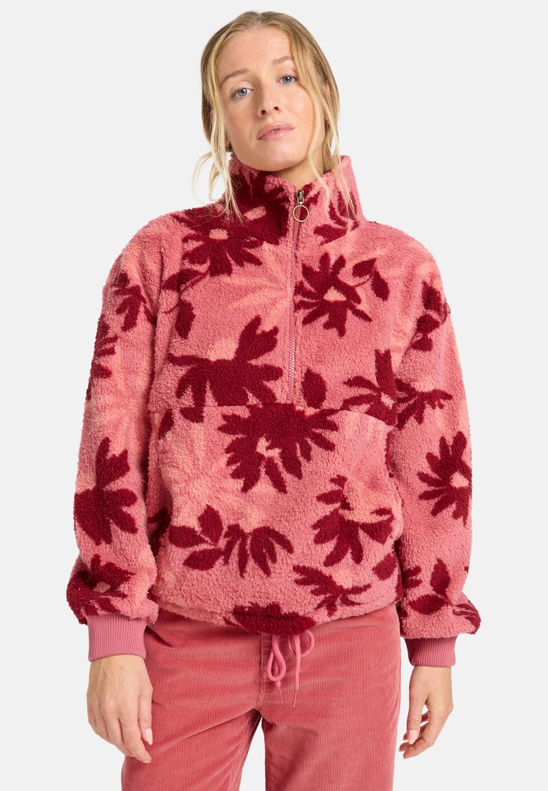 Fleece-Pullover mit pinker Basis und rotem Blumenmuster, ausgestattet mit einem halben Reißverschluss, hohem Kragen und gerippten Bündchen. Weicher Stoff.