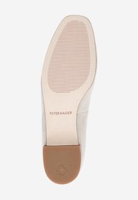 Beige suede shoe sole with a textured rubber base, featuring vertical ridges for grip and stamped branding "PETER KAISER" and logo.