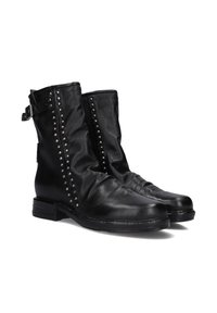 Black leather ankle boots with a slouchy design, silver stud accents along the side, and a buckle detail on the strap. Flat sole.