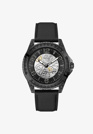 Męski czarny zegarek na skórzanym pasku, okrągła metalowa koperta, skomplikowana srebrna tarcza, czarne akcenty kryształowe oraz duże cyfry.