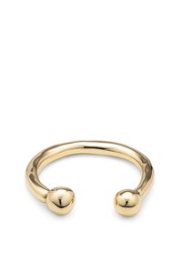 Brazalete de metal con tono dorado, de diseño liso y redondeado con dos extremos esféricos y acabado pulido.