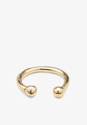 Brazalete de metal con tono dorado, de diseño liso y redondeado con dos extremos esféricos y acabado pulido.