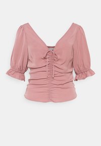 Top de manga abombada en tela rosa apagada, con un profundo escote en V y detalle de lazo en el centro, adornado con fruncidos en el busto y el dobladillo.