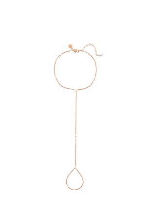 Delicate rose gold chain bracelet with extended loop designed to encircle a finger, featuring a small sun-shaped charm near the clasp.