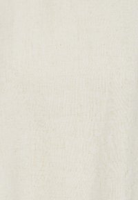 Tissu texturé de couleur crème avec un motif de tissage subtil visible sur toute la surface.