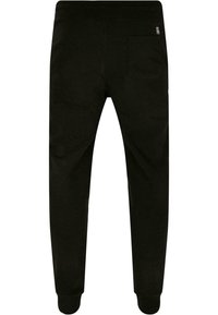 Sorte sweatpants med en tapered design, elastisk talje og manchetter ved anklerne. Har en enkelt baglomme. Lavet af blødt bomuldsstof.