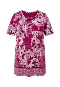 V-Ausschnitt, Kurzarm-Tunika in Fuchsia mit weißen Blumen- und abstrakten Mustern, mit aufwendiger Borte am Saum. Hergestellt aus leichtem Stoff.