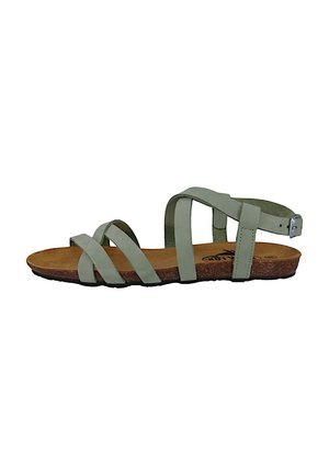 Green leather sandal with multiple crisscross straps, a cushioned brown footbed, and a buckle ankle strap. Flat sole with textured detailing.