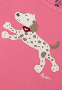 Pink fabric with a playful embroidered dog design. The dog is white with brown spots and a red scarf with a heart detail.