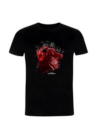 Camiseta de algodón negra con un gráfico rojo de una figura musculosa, con líneas bold y efecto de salpicadura, centrado en el frente.
