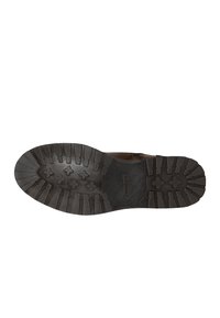 Suola di scarpa in gomma marrone con superficie testurizzata, caratterizzata da motivi rettangolari e incrociati per una migliore presa. Logo "WOLGOS" vicino al centro.