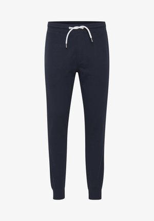 Marineblå joggebukser laget av myk bomull, med snor i livet, tapered ben og ribbede mansjetter for en behagelig passform.